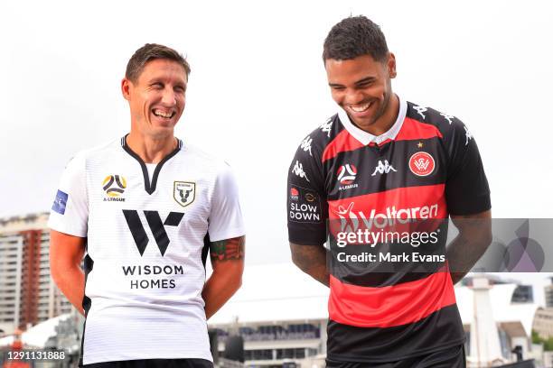 Mark Milligan of Macarthur FC poses with Kwame Yeboah of Western Sydney Wanderers during the Fox Sports A League season Launch at Darling Harbour on...