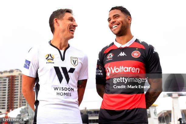 Mark Milligan of Macarthur FC poses with Kwame Yeboah of Western Sydney Wanderers during the Fox Sports A League season Launch at Darling Harbour on...