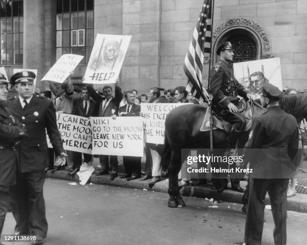 Hungarian demonstrators form an anti-Khrushchev picket in protest outside The Commodore Hotel, which is hosting an official city luncheon for...