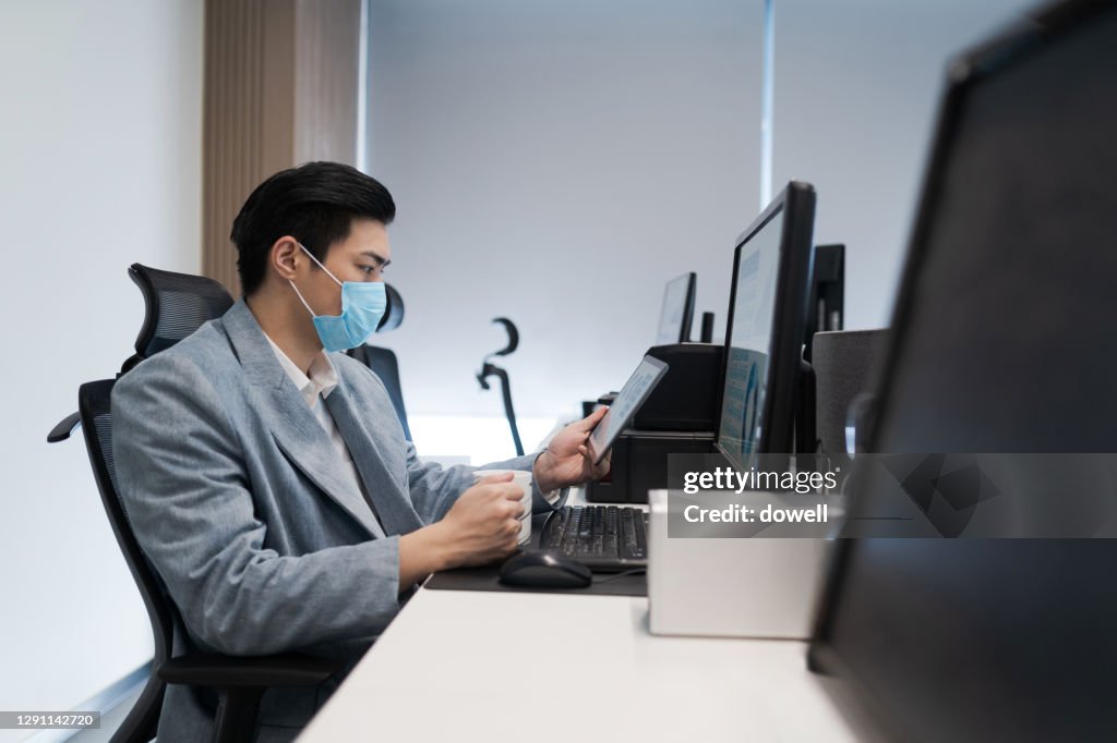 Japanese Man Using Computer Asian Man Working With Business Report On Computer High-Res Stock Photo ...