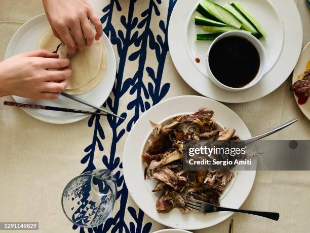 preparing homemade roast duck pancakes - hoisin sauce stock pictures, royalty-free photos & images