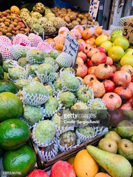 custard apples on sale at market - cherimoya stock pictures, royalty-free photos & images