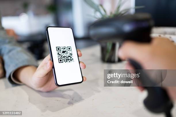 contaceless payment via smart phone - scanning activity stock pictures, royalty-free photos & images