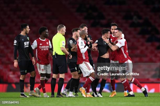 Granit Xhaka of Arsenal grabs Ashley Westwood of Burnley by the neck which resulted in a VAR Red Card during the Premier League match between Arsenal...