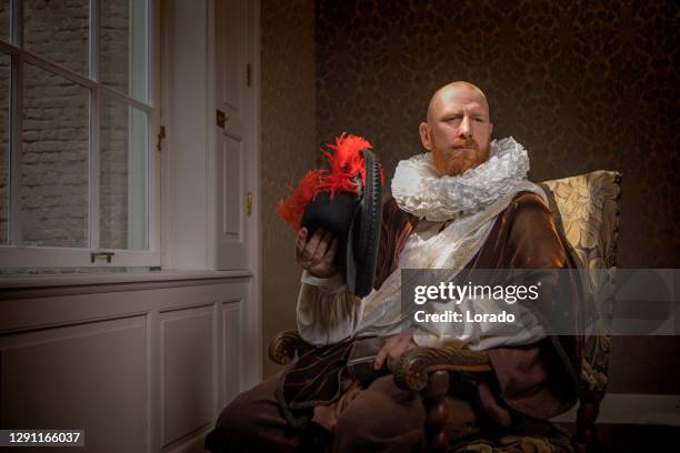redhead traditional dutch man by candlelight - duke painting stock pictures, royalty-free photos & images