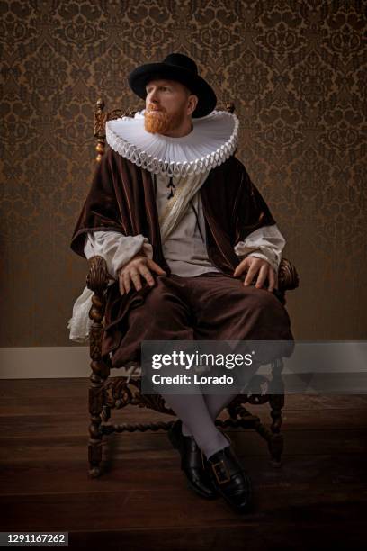 redhead traditional dutch man by candlelight - cosplay stock pictures, royalty-free photos & images