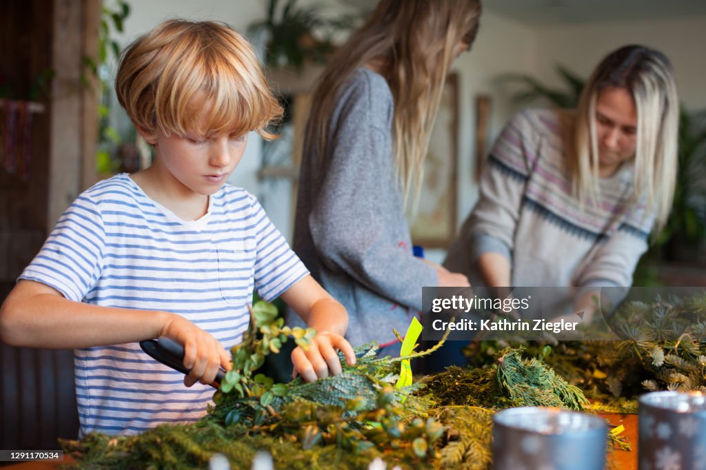 Family making an advent wreath