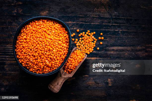 red lentils in a bowl shot from above. copy space - lentils stock pictures, royalty-free photos & images