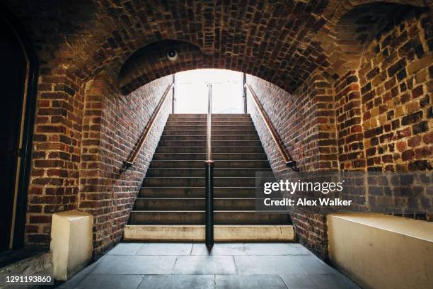 underground brick tunnel with staircase - heaven stairs stock pictures, royalty-free photos & images