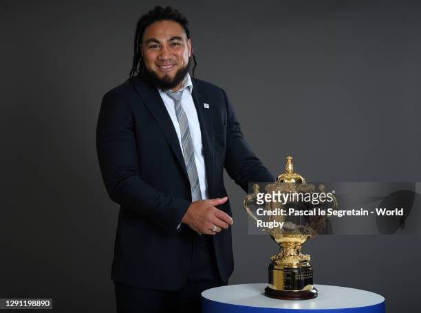 Former New Zealand Player, Ma'a Nonu poses with The Webb Ellis Cup prior to the Rugby World Cup France 2023 draw at Palais Brongniart on December 14,...