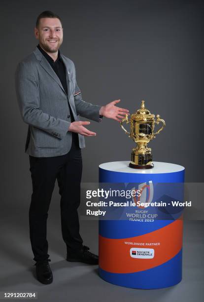 Finn Russell of Scotland poses with The Webb Ellis Cup prior to the Rugby World Cup France 2023 draw at Palais Brongniart on December 14, 2020 in...