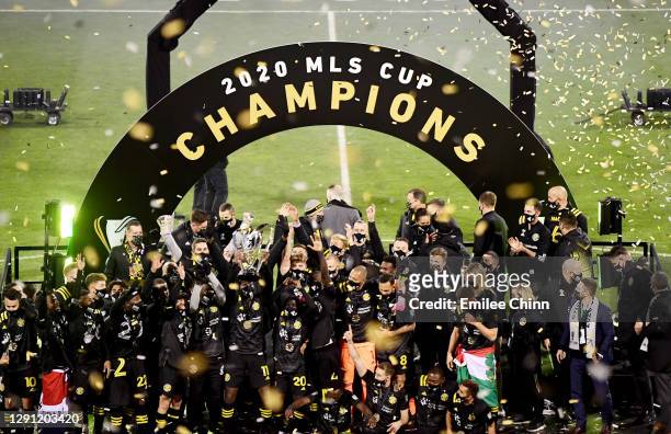 The Columbus Crew celebrates with the MLS Cup after a 3-0 win over the Seattle Sounders during the MLS Cup Final at MAPFRE Stadium on December 12,...