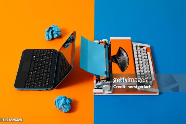 digital and analog – laptop and 70s typewriter - digitalisation stock pictures, royalty-free photos & images