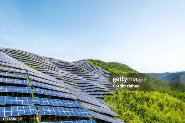 there are solar panels on the lush mountains - new challenge stock pictures, royalty-free photos & images