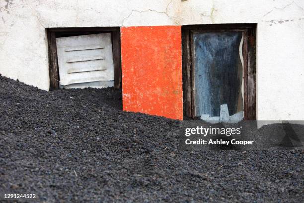 a house partially buried by volcanic ash from the 1973 heimaey eruption,westmann islands, iceland. - 1973 stock pictures, royalty-free photos & images