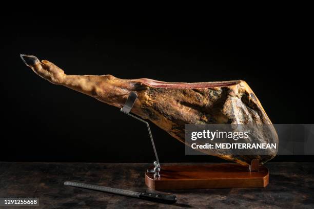 iberian ham iberic ham leg at ham holder black hoof whole jamon iberico - iberia stock pictures, royalty-free photos & images