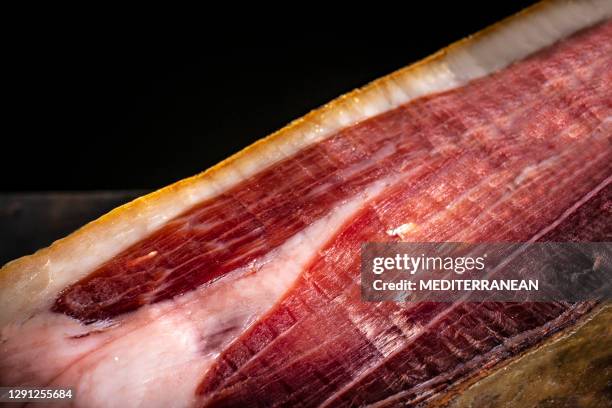 iberian ham serrano ham black hoof from iberian pig from spain closeup meat - serrano ham stock pictures, royalty-free photos & images