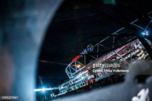 The stadium is reflected in a car window prior the Bundesliga match between Bayer 04 Leverkusen and TSG Hoffenheim at BayArena on December 13, 2020...
