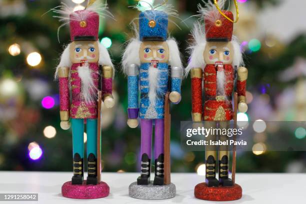 nutcrackers and christmas bokeh - nutcracker stock pictures, royalty-free photos & images