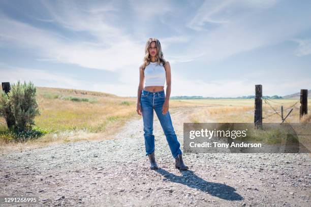 portrait of young woman outdoors - black boot fotografías e imágenes de stock