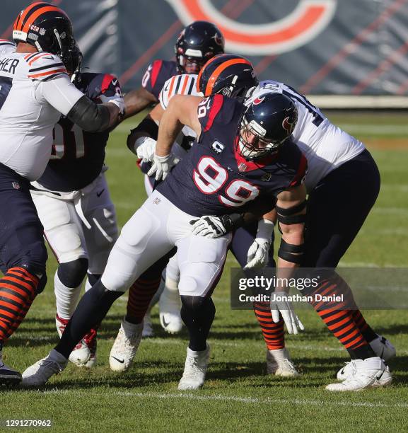 Watt of the Houston Texans rushes against Germain Ifedi of the Chicago Bears at Soldier Field on December 13, 2020 in Chicago, Illinois. The Bears...