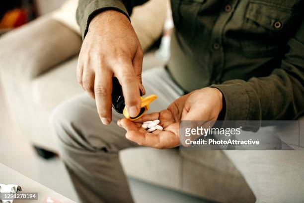 taking a pill at home - diabetes pills stock pictures, royalty-free photos & images