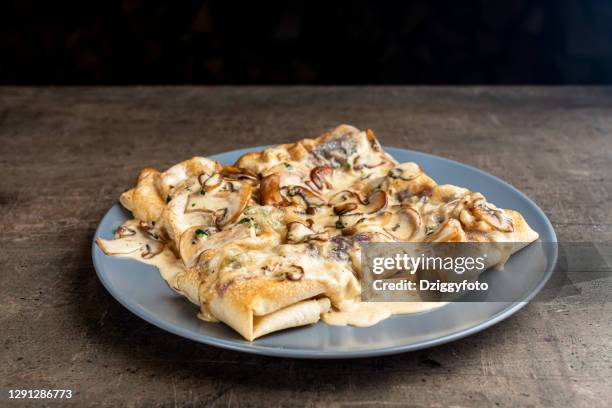 doner kebab with mushrooms and savory sauce in a plate - lavash stock pictures, royalty-free photos & images