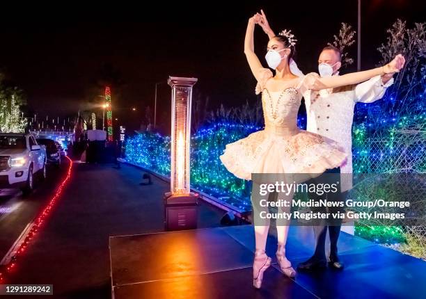 Dancers Susan Vishmid, left, and AJ Abrams perform for visitors touring the Light of the World: Christmas Lights at Saddleback at Saddleback Church...