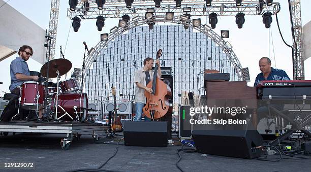 Percussionist Billy Martin, bassist Chris Wood and keyboardist John Medeski of Medeski Martin & Wood performs during the 2011 Hangout Music Festival...