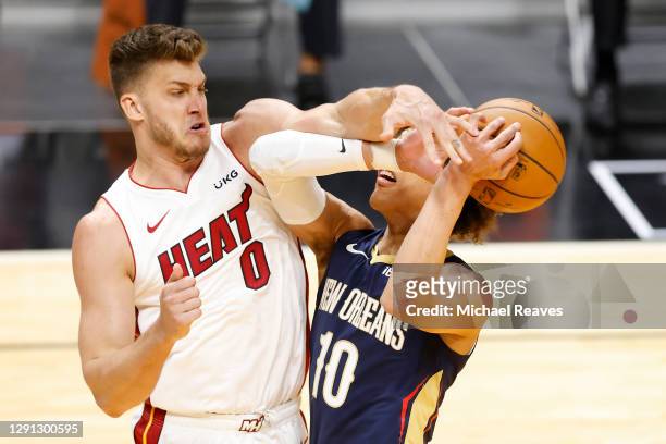 Meyers Leonard of the Miami Heat blocks a shot by Jaxson Hayes of the New Orleans Pelicans during the first quarter of a preseason game at American...