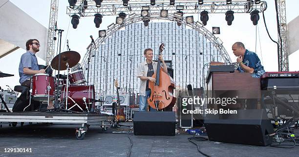 Percussionist Billy Martin, bassist Chris Wood and keyboardist John Medeski of Medeski Martin & Wood performs during the 2011 Hangout Music Festival...