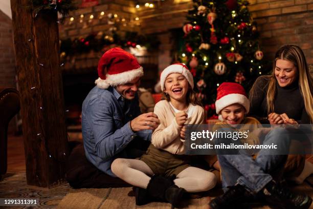 family love is all they need on christmas - cócegas imagens e fotografias de stock