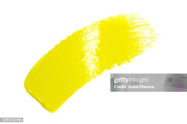 stain of yellow paint on paper. trendy colors of 2021 year - slugs stock-fotos und bilder