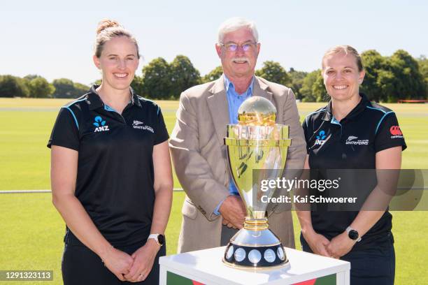 New Zealand White Ferns players Amy Satterthwaite and Lea Tahuhu pose with Sir Richard Hadlee and the Women's World Cup trophy during the ICC Women's...