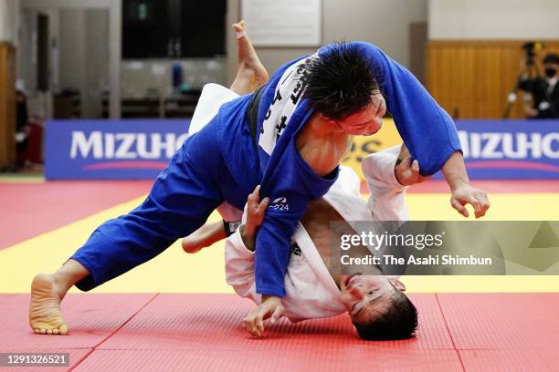 Hifumi Abe throws Joshiro Maruyama to win the Judo Men's -66kg Tokyo Olympic playoff at Kodokan on December 13, 2020 in Tokyo, Japan.