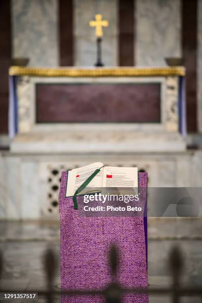 the holy book of the gospels displayed inside a catholic church on the aventine hill in the heart of rome - episcopal conference stock pictures, royalty-free photos & images