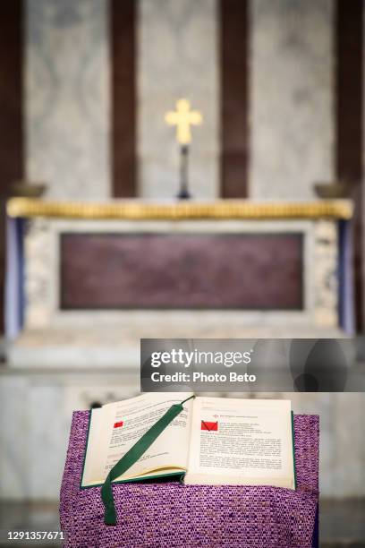 the holy book of the gospels displayed inside a catholic church on the aventine hill in the heart of rome - episcopal conference stock pictures, royalty-free photos & images