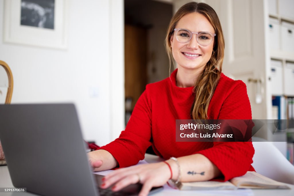 Young woman working at home