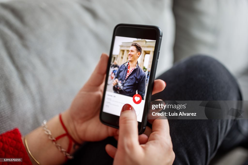 Female using a dating app on smart phone