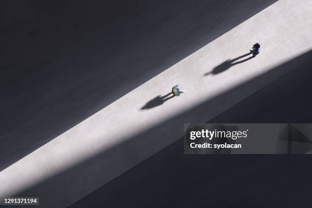 encounter in a narrow maze - narrow stock pictures, royalty-free photos & images