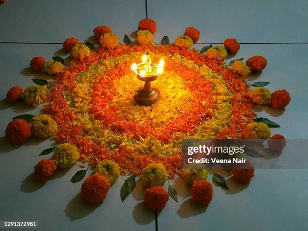 onam pookalam/floral carpet/rangoli-kerala/onam festival - pookalam stock pictures, royalty-free photos & images