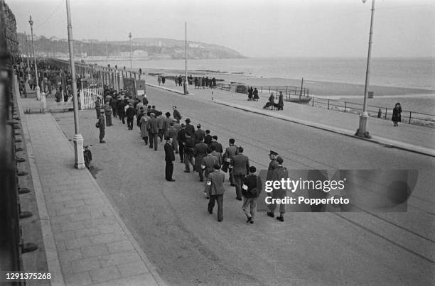 Group of internees walk back to their Internment Camp following their weekly visit to a cinema in the town of Douglas on the Isle of Man during World...