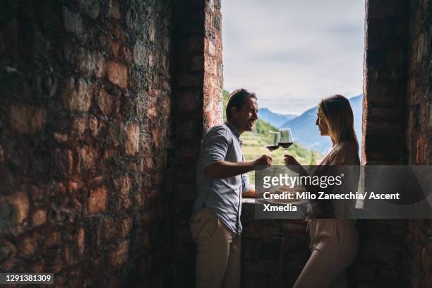 couple enjoy a winery together - three quarter length stock pictures, royalty-free photos & images
