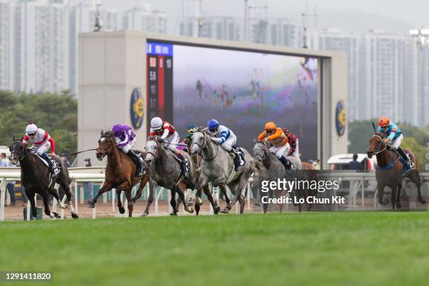 Jockeys compete the Race 8 Longines Hong Kong Cup at Sha Tin Racecourse on December 13, 2020 in Hong Kong.