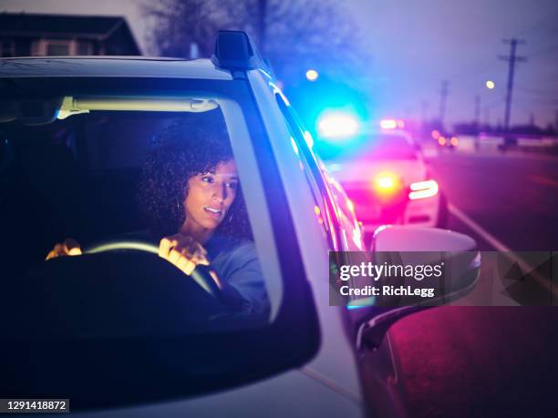 nightime police traffic stop - pulled over by police stock pictures, royalty-free photos & images