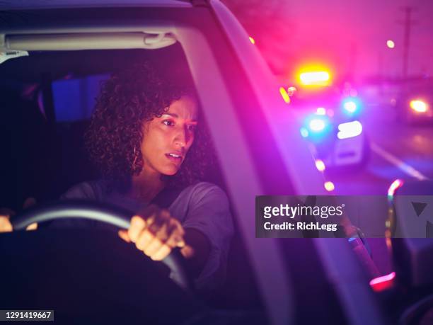 nightime police traffic stop - pulled over by police stock pictures, royalty-free photos & images