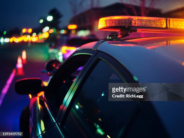 nightime police traffic stop - police stock pictures, royalty-free photos & images