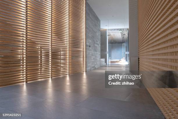 corridor of modern business space - wood material architectural wall stock pictures, royalty-free photos & images