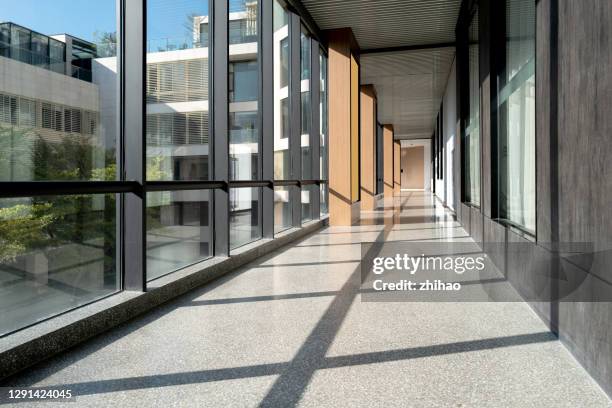sunny business space corridor - building storey stock pictures, royalty-free photos & images
