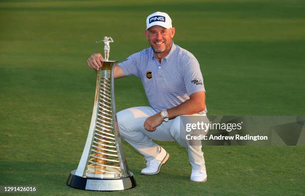 Lee Westwood of England poses with the Race to Dubai trophy during Day Four of the DP World Tour Championship at Jumeirah Golf Estates on December...